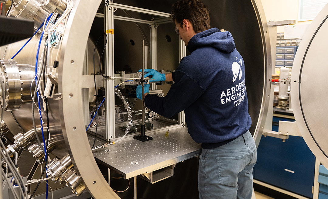 Person in front of a vacuum chamber