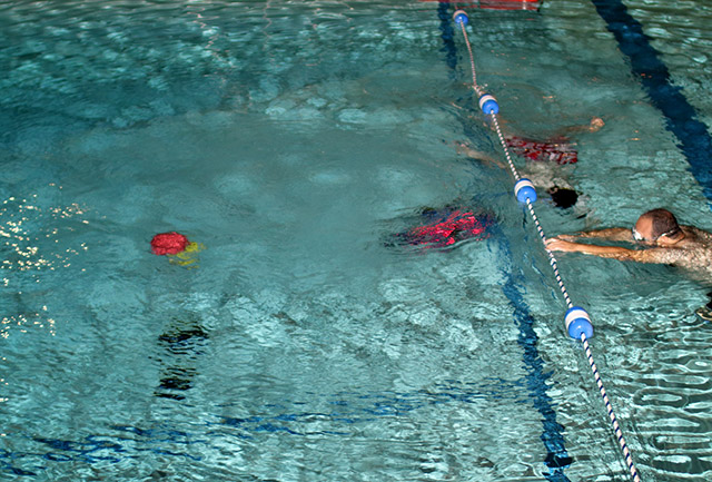 [Picture] The swimmers watch as the AUV attempts to detect the red and yellow buoys.