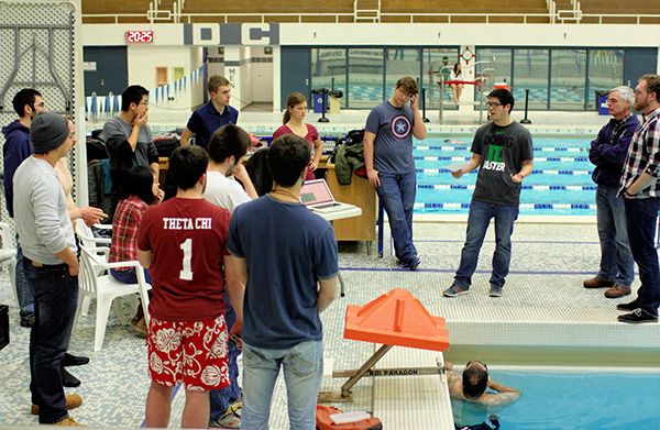 [Photo] Albert explains the evening's test objectives to the class.