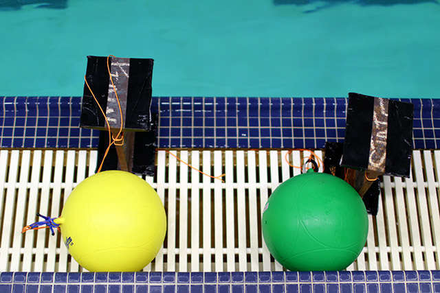 [Picture] Two buoys are tethered to their anchors and will be submerged.